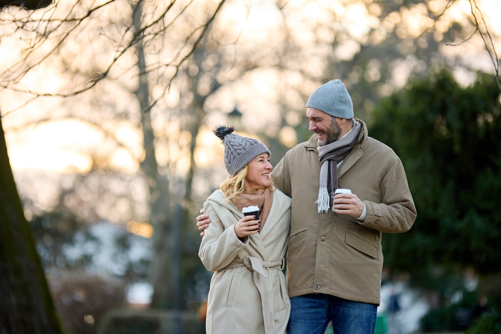 Couple walking in the winter enjoying things to do in Rockland during their romantic Maine getaways